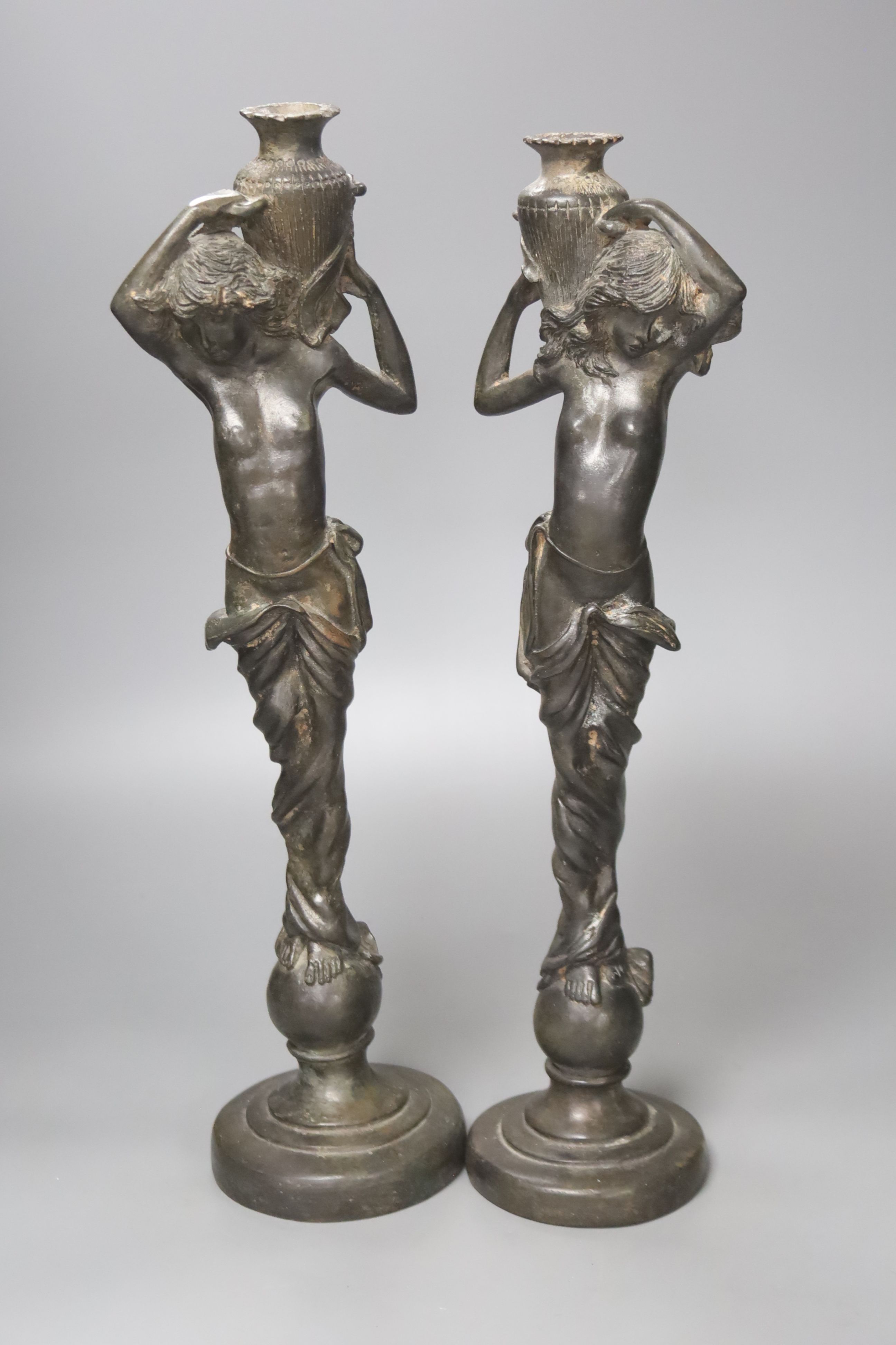 A pair of spelter figural water carriers, 42cm high